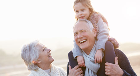 Grandparents with their young grand daughter